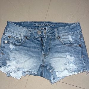 American Eagle stretch shortie shorts. Had ripped jean design.